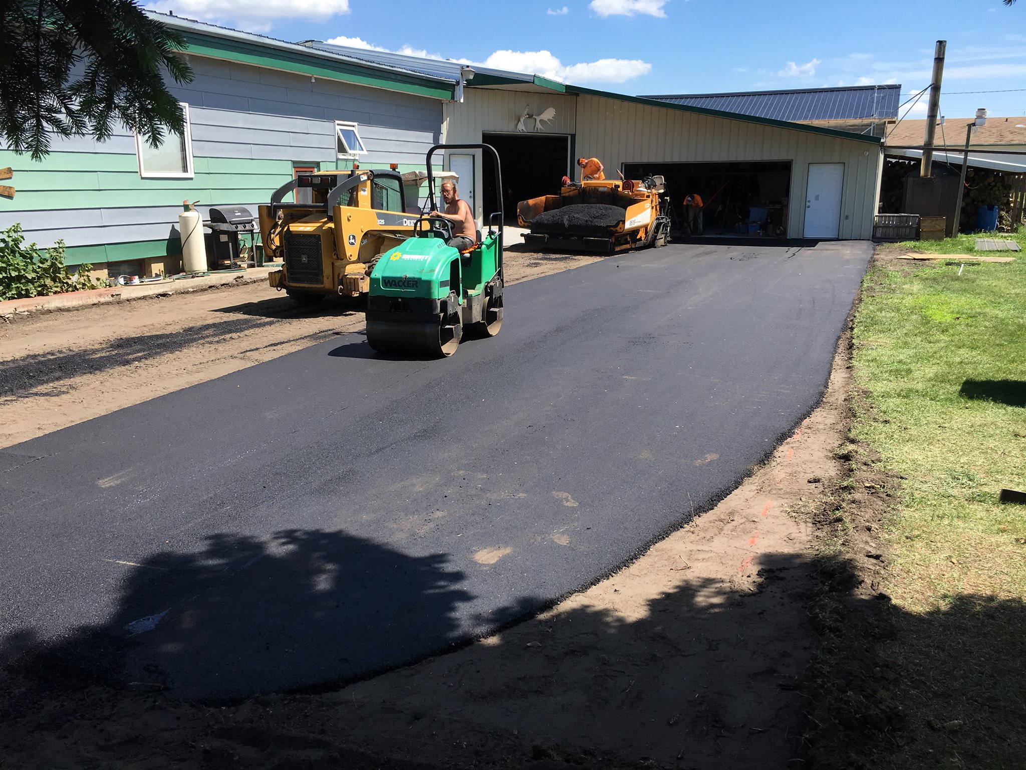 Crew rolling fresh asphalt